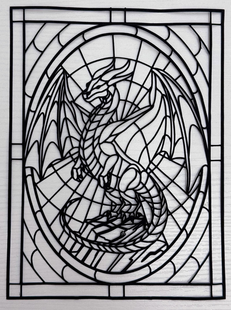 This is the caming for the stained glass dragon design. It is cut from one 6in x 8in piece of fabric. Black outlines for a stained glass design cut from a single piece of fabric